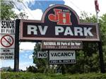 View larger image of Main business sign near entrance at J  H RV PARK image #8