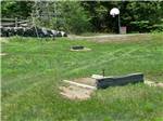 View larger image of The horseshoe pits and swing set at TWIN TAMARACK FAMILY CAMPING  RV RESORT image #9