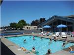 View larger image of People swimming in the pool at PORTLAND WOODBURN RV PARK image #5