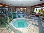 View larger image of Indoor hot tubs with green and white tile flooring at CARSON VALLEY RV RESORT  CASINO image #6