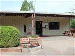 View larger image of Campground office festooned with decorative lights at ELK CREEK RV PARK image #2