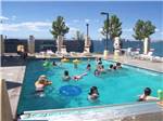 View larger image of People playing in the swimming pool at AMERICAN RV RESORT image #7