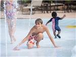 Kids playing in the splash pool at CHERRY HILL PARK - thumbnail
