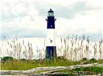 View larger image of A blue and white lighthouse nearby at RIVERS END CAMPGROUND image #1