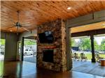 The indoor fireplace with doors on both sides at PIGEON FORGE RV RESORT - thumbnail