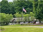 Main building surrounded by trees at INDIGO BLUFFS RV PARK AND RESORT - thumbnail
