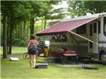 Guest enjoying time outside her RV at INDIGO BLUFFS RV PARK AND RESORT - thumbnail