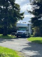 Parked RV at site Mad River Rapids RV Park - thumbnail