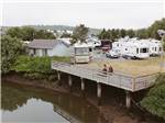 A deck overlooking the water at LUCKY LOGGERS RV PARK - thumbnail