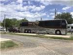 A bus conversion in a pull thru site at WICHITA FALLS RV PARK - thumbnail