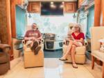 A couple and their dog sitting inside their motorhome at ESCONDIDO RV RESORT - thumbnail