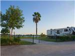 A gated paved back in RV site overlooking the water at HOUSTON EAST RV RESORT - thumbnail