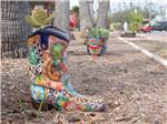 View larger image of A planter in the shape of a cowboy boot at TEXAS TRAILS RV RESORT image #3