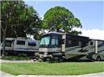 View larger image of A row of Motorhomes in RV sites at SUNSHINE TRAVEL RV RESORT image #5