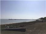 The beach with a pier at SEAWIND RV RESORT ON THE BAY - thumbnail