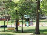 View larger image of Play area with slides swing set and more at ST CLOUD CAMPGROUND  RV PARK image #11