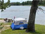 A tent site by the water at LUNDEEN'S LANDING - thumbnail