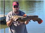A man holding a large fish at LUNDEEN'S LANDING - thumbnail