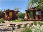 Guest cabins and a fire pit at CANYONS OF ESCALANTE RV PARK - thumbnail