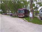 View larger image of Gravel RV sites with large trees at ON-UR-WA RV PARK image #3