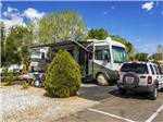 View larger image of Class A Motorhome parked on-site at TWENTYNINE PALMS RESORT RV PARK AND COTTAGES image #8