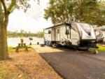 Parked RV near panic table at Flamingo Lake Sun RV Communities - thumbnail