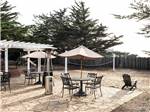 View larger image of A seating area with umbrellas at MARINA DUNES RV RESORT image #4