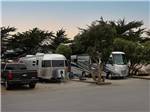 View larger image of A row of RVs in sites at MARINA DUNES RV RESORT image #5