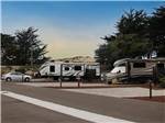 View larger image of A row of paved RV sites at MARINA DUNES RV RESORT image #6