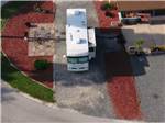 A drone shot of a large motorhome parked at DAYTONA RV OASIS - thumbnail