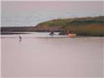 View larger image of Two kayakers at sunset at OCEAN SURF RV PARK image #7