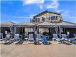 Pool area with cabanas and lounge chairs - thumbnail