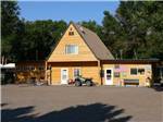 Wood general store with ATV in front at EAGLE RV PARK & CAMPGROUND - thumbnail