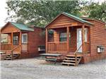 Wooden rental cabins with decks at EAGLE RV PARK & CAMPGROUND - thumbnail
