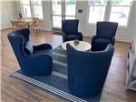 Blue chairs arrayed around table in room at ST AUGUSTINE RV RESORT - thumbnail