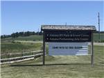 View larger image of Sign near main entrance for guests at AMANA RV PARK  EVENT CENTER image #11