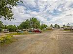 A gravel road next to back in RV sites at HAROLD W. DUFFETT SHRINERS RV PARK - thumbnail
