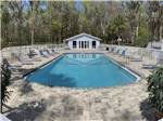 View larger image of Lounge chairs around the pool at OCALA NORTH RV RESORT image #1