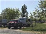 View larger image of SUV and trailer in a gravel site at UMATILLA MARINA  RV PARK image #4