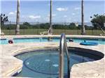 Hot tub and pool in background at RIVER BEND RESORT & GOLF CLUB - thumbnail