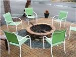 A fire pit surrounded by chairs at FLAT CREEK FAMILY CAMPGROUND - thumbnail
