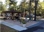 A gazebo and fire pit at FLAT CREEK FAMILY CAMPGROUND - thumbnail