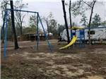 The playground equipment at FLAT CREEK FAMILY CAMPGROUND - thumbnail