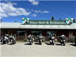 A row of motorcycles parked at the front entrance - thumbnail
