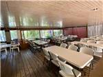 View larger image of Table and chairs in the rec hall at TWO LAKES CAMPING AREA image #5