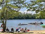 View larger image of People sitting on the beach at TWO LAKES CAMPING AREA image #11