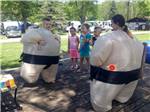 Two kids in inflatable sumo suits at LAKE BLUFF CAMPGROUND - thumbnail