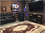 Lounge area with big screen TV and couches at Lifestyle RV Resort - thumbnail