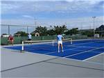 People playing pickleball at CAMP HATTERAS RV RESORT & CAMPGROUND - thumbnail