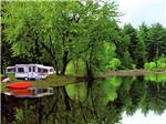 View larger image of Pop up trailer parked next to the lake at LAKE GEORGE ESCAPE CAMPING RESORT image #1